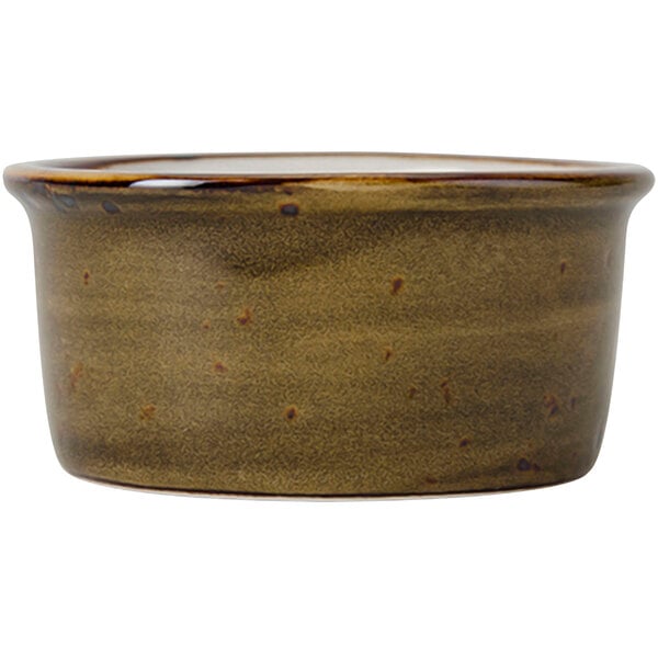 A brown Tuxton China ramekin with a brown surface.