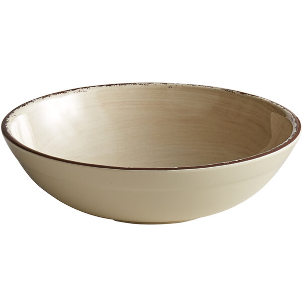 A white bowl with a brown rim.