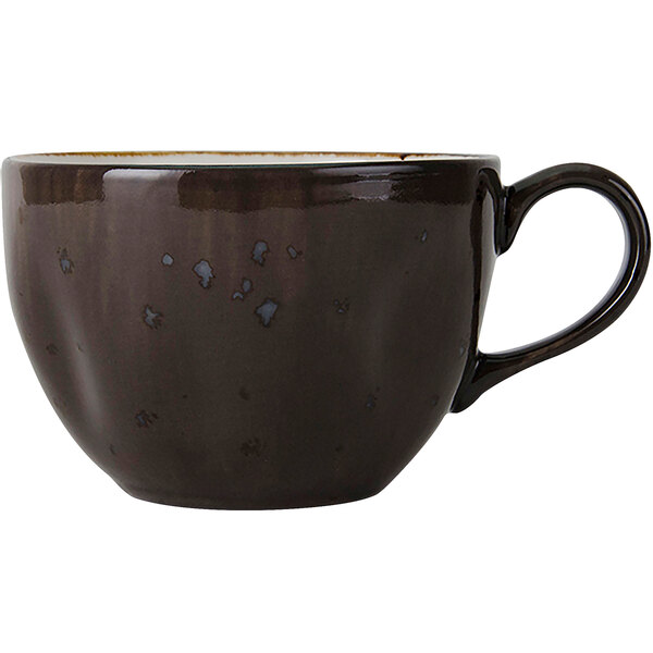 A brown Tuxton china cup with a handle.