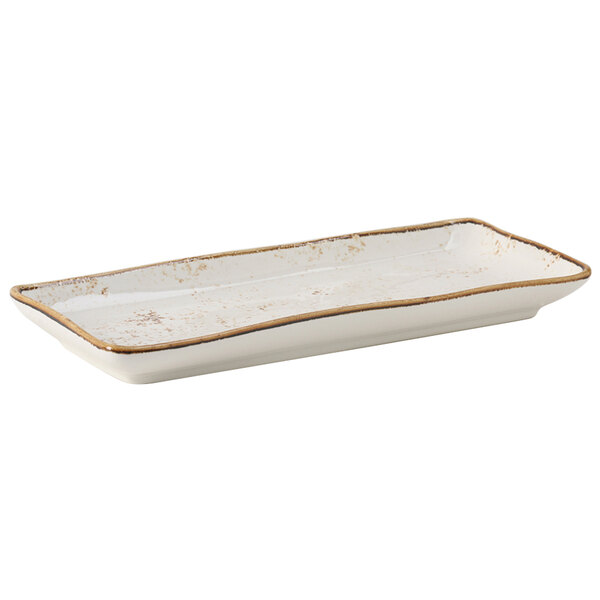 A rectangular white plate with gold trim.