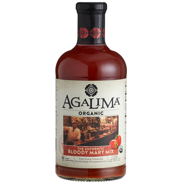 A bottle of Agalima Organic Bloody Mary Mix on a table with a white label.
