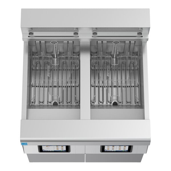 A commercial electric floor fryer with two full frypots, automatic filtration, and digital controls.