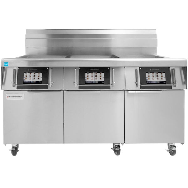 A large stainless steel commercial kitchen appliance with three Frymaster frypots.