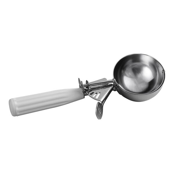 A metal scoop with a white handle and a thumb press mechanism.
