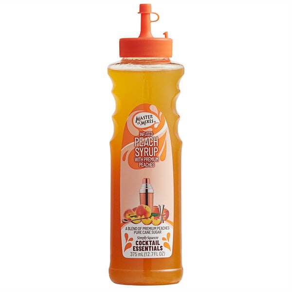 A labeled bottle of Master of Mixes Peach Syrup with a straw lid on the counter.