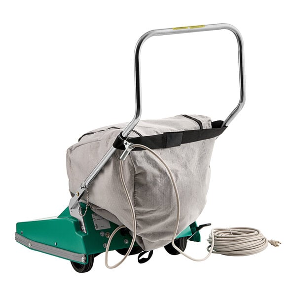 A Bissell Commercial wide area vacuum cleaner with a bag on it.