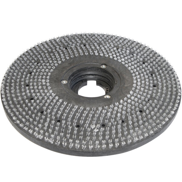 A circular metal Bissell Commercial pad driver with white bristles.