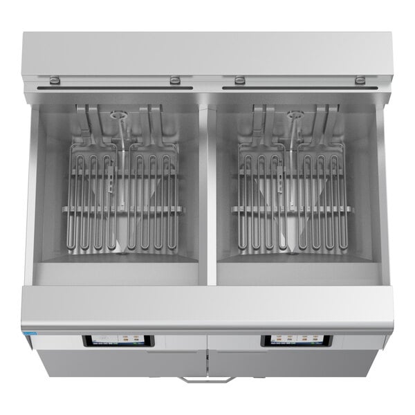 A commercial electric floor fryer with two large frypots and automatic filtration system.