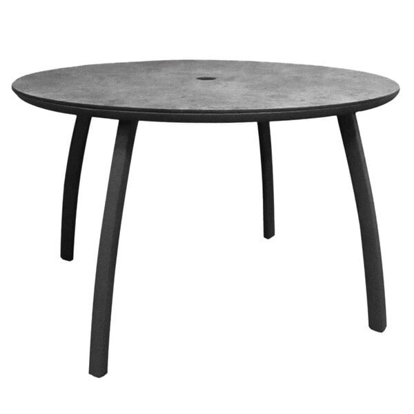 a black circle on a square surface