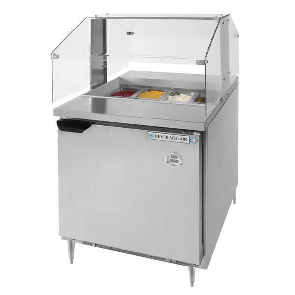 A Beverage-Air refrigerated sandwich prep table with a sneeze guard over food containers on a counter.