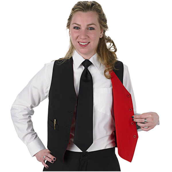 A woman in a black and red Henry Segal server vest and tie.