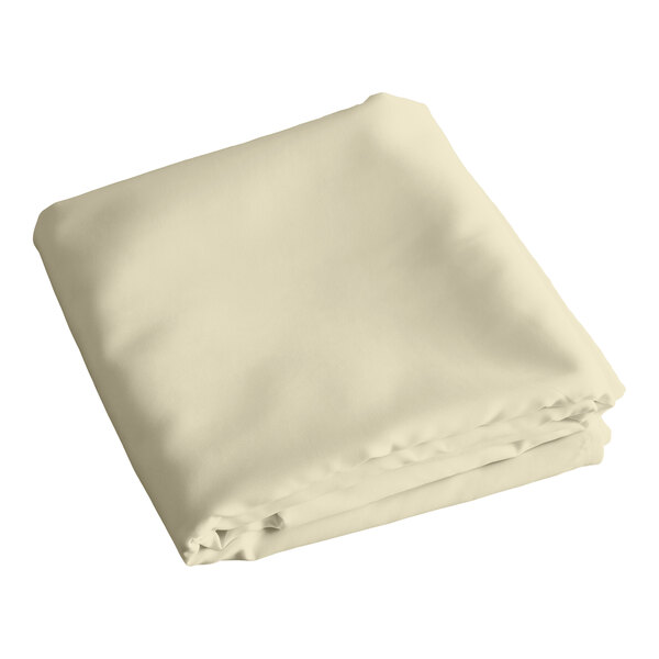 A folded ivory rectangular table cover.