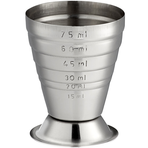A stainless steel measuring jigger with numbers on it.