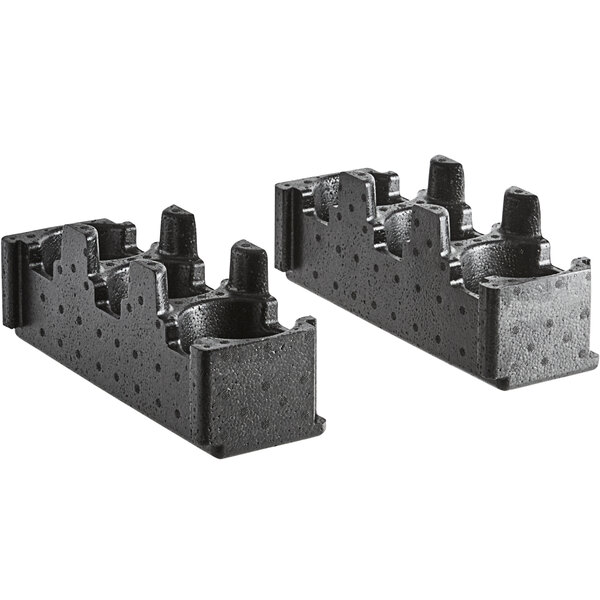 Two black plastic blocks with holes for cups.