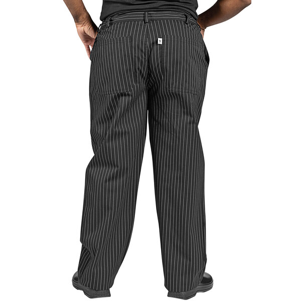 a person wearing black pants with white pinstripes
