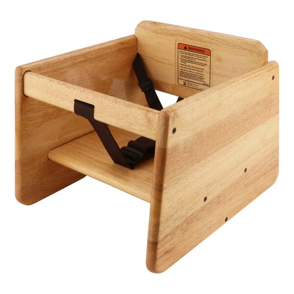 A natural wood booster seat with a seat strap.