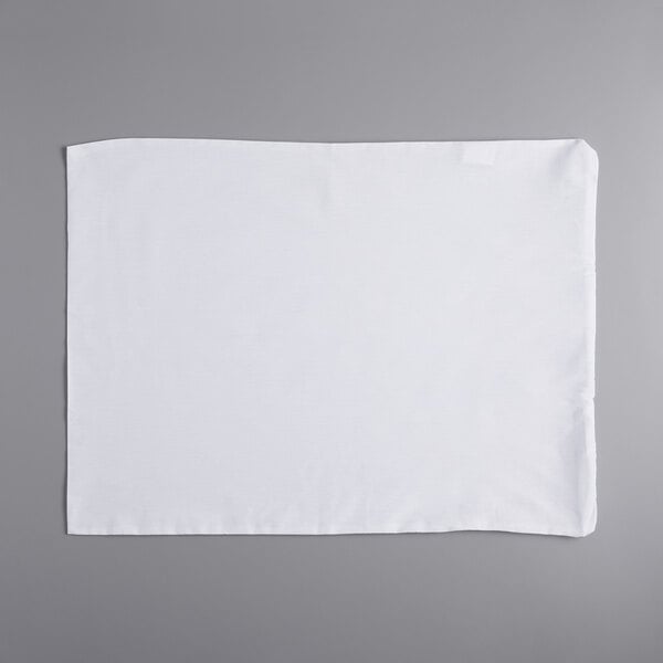 A white Oxford Standard Size Waterproof Zippered Pillow Protector on a gray surface.