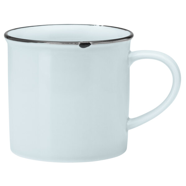 a white mug with a black rim