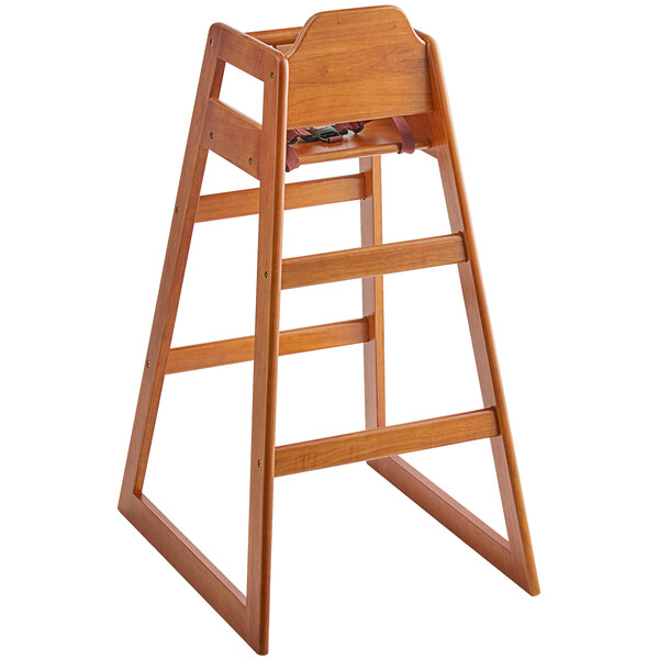A Lancaster Table & Seating wooden high chair with a walnut finish.