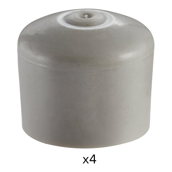 A white plastic object with four holes.