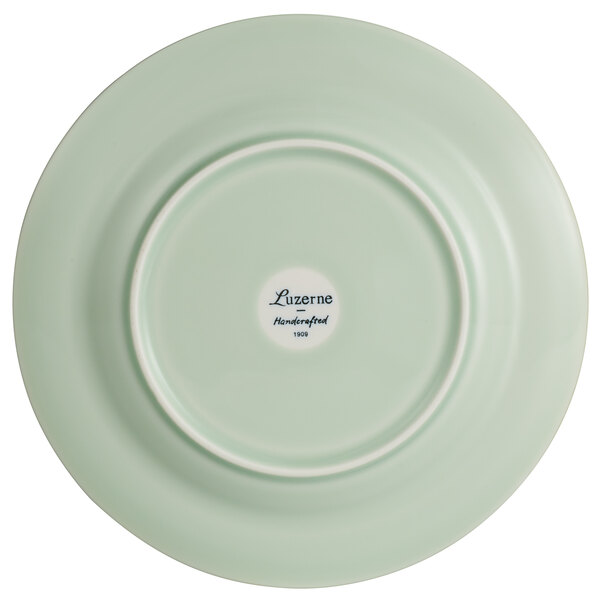 A Luzerne green porcelain plate with a white rim.
