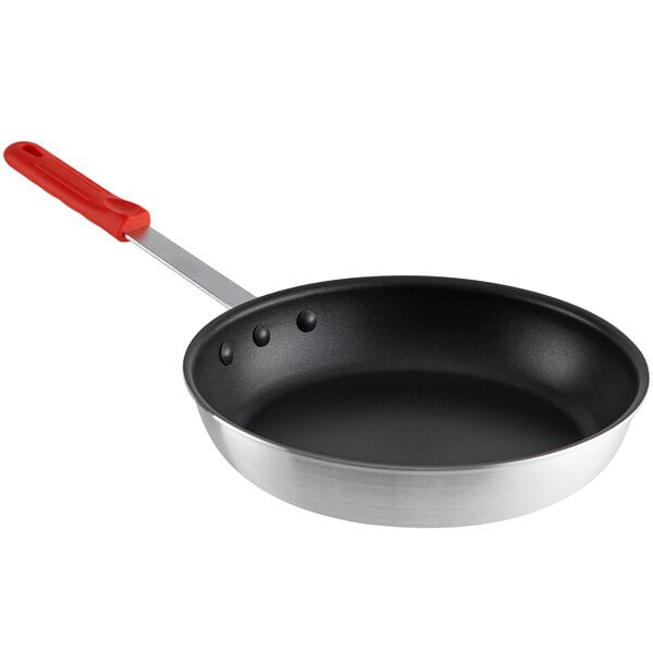 A 12" aluminum non-stick frying pan with a red silicone handle.