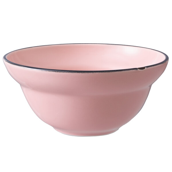 a pink bowl with black rim