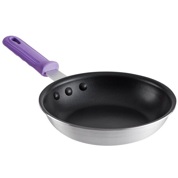 An 8" aluminum fry pan with a purple silicone handle.