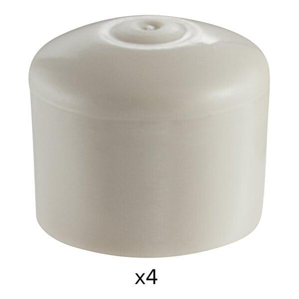 A white plastic cylinder with four round caps.