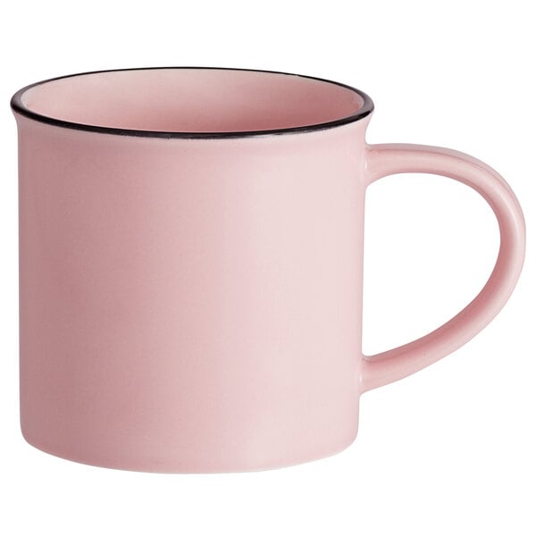 A pink Luzerne Tin Tin porcelain coffee mug with a black rim.