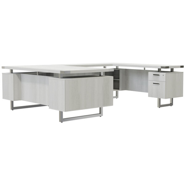 A Safco Mirella white ash U-shaped desk with storage drawers and a file drawer.