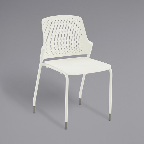 A white plastic Safco Next chair with a perforated backrest.