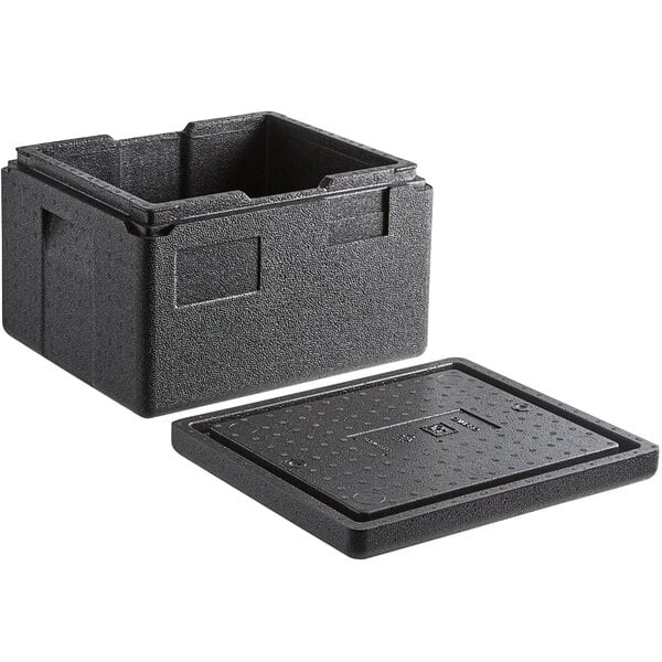 A black plastic Cambro Cam GoBox with a lid on a table.