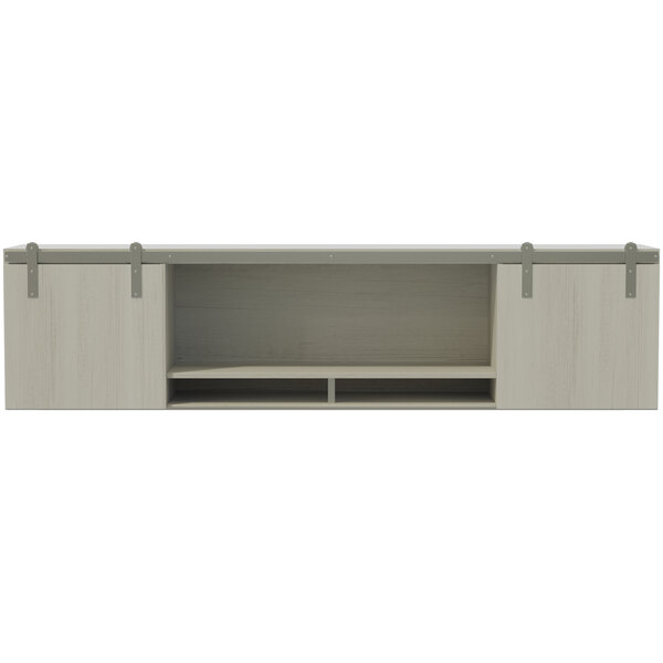 A white shelf with a Safco Mirella white wall-mounted hutch with sliding wood doors.