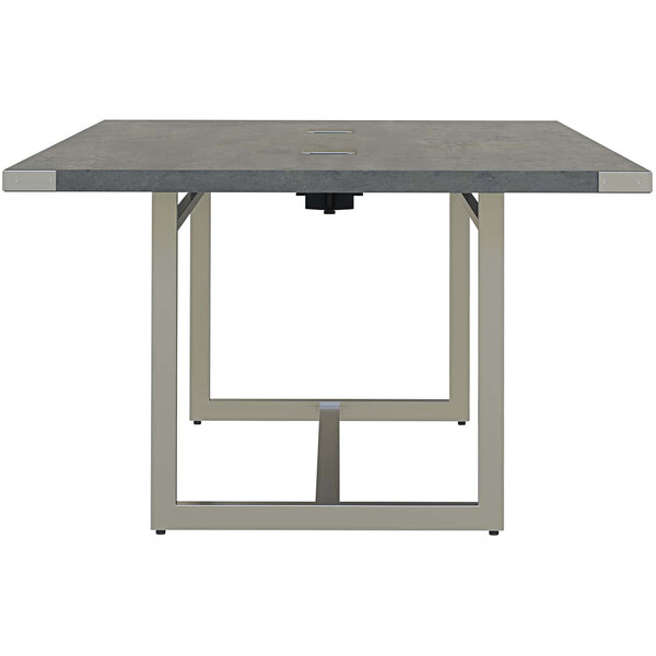 A Safco Mirella rectangular conference table with a stone grey top and metal base.