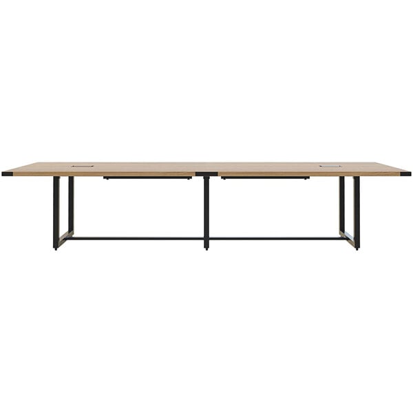 A Safco Mirella rectangular conference table in sand dune finish with two black metal legs.