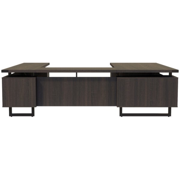 A Safco Mirella Southern Tobacco U-shaped desk with drawers on top.