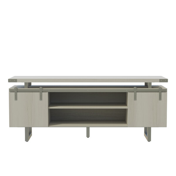 A Safco Mirella white low wall cabinet with sliding wood doors.