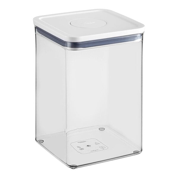 A clear square plastic food storage container with a white lid.