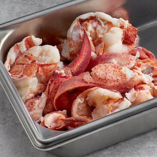 A metal container filled with Boston Lobster Company lobster meat.
