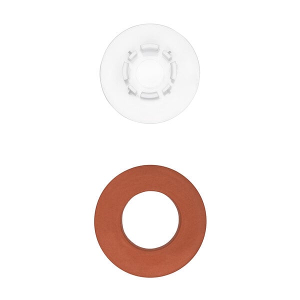 A white circular object with two brown and white plastic buttons in the center.