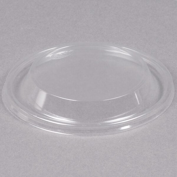 A clear plastic container with a clear dome lid on it.
