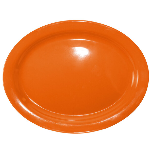 An orange stoneware oval platter.