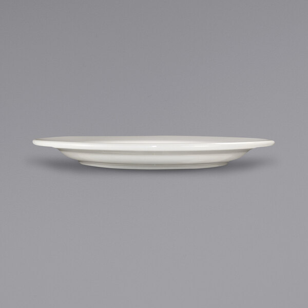 a white plate on a gray background