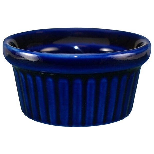 A cobalt blue stoneware fluted ramekin.