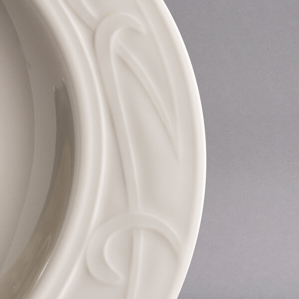 A Homer Laughlin ivory china plate with a design on it.