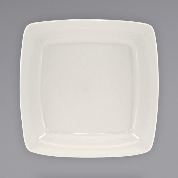 A white square International Tableware stoneware plate with a wide square rim.