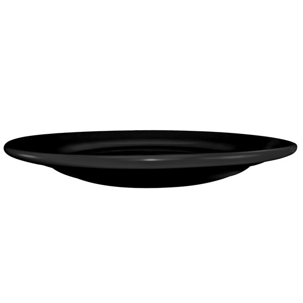 An International Tableware black stoneware plate with a wide rim.