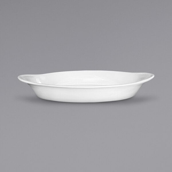 A white oval International Tableware rarebit dish.
