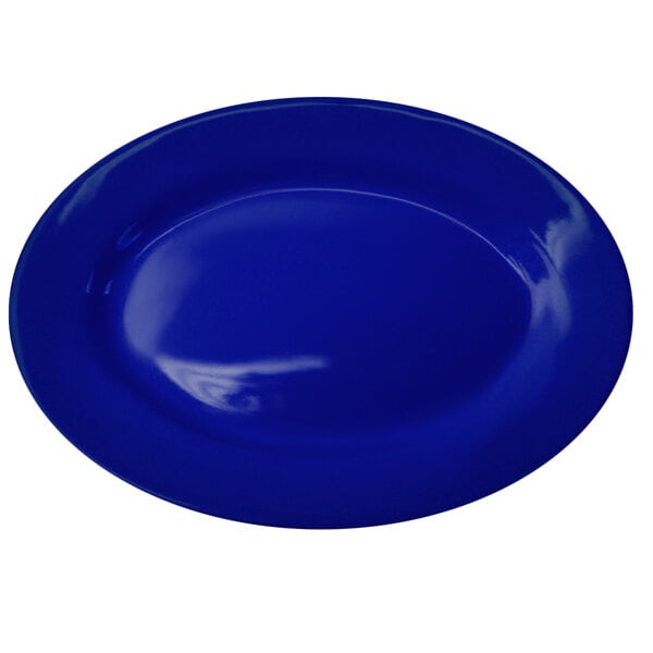 A cobalt blue stoneware platter with white lines on the rim.